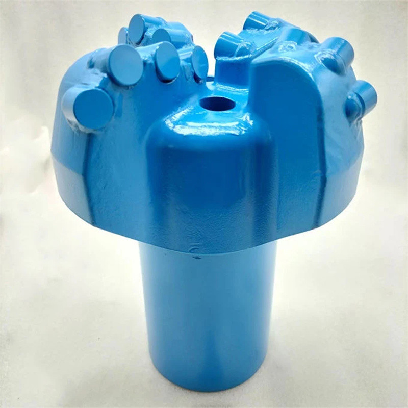 Four Wing Reinforced Arc Angle Coreless Bit